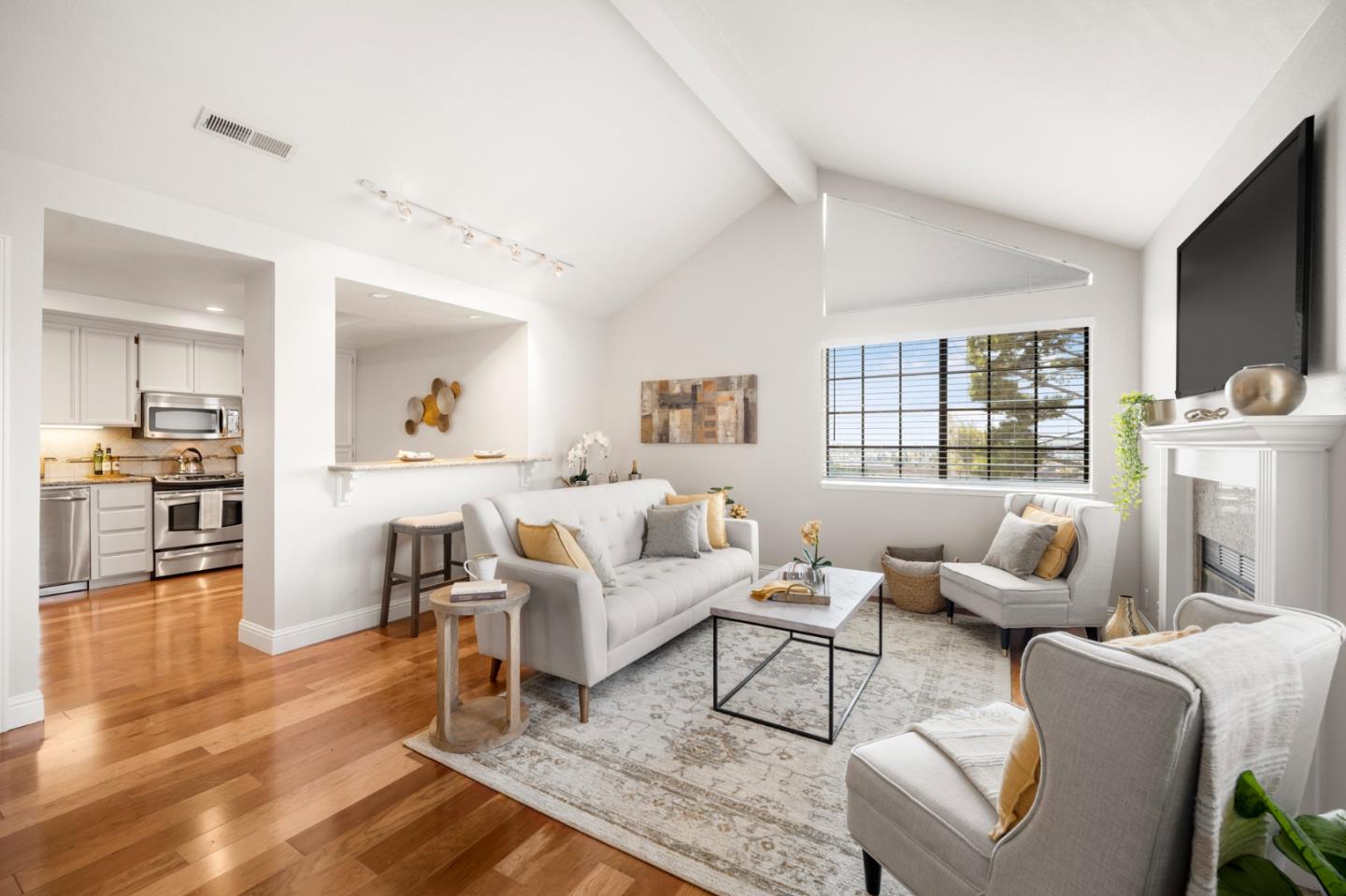 a living room with furniture and a large window