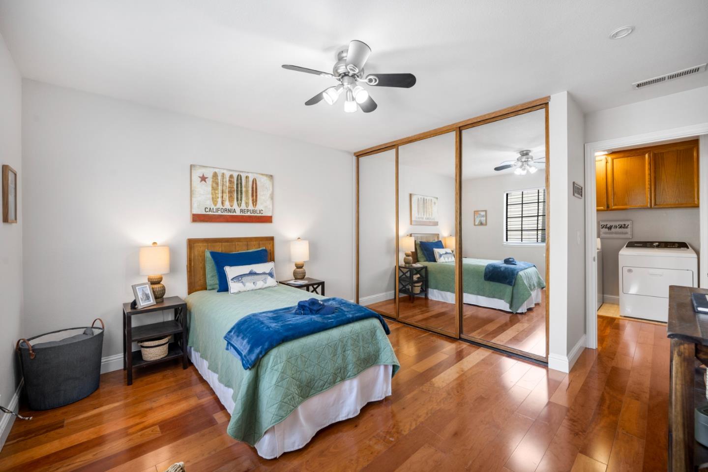 3053 Elk Ridge Court San Jose, CA 95136 - Photo 11 of 21 a bedroom with a bed and wooden floor