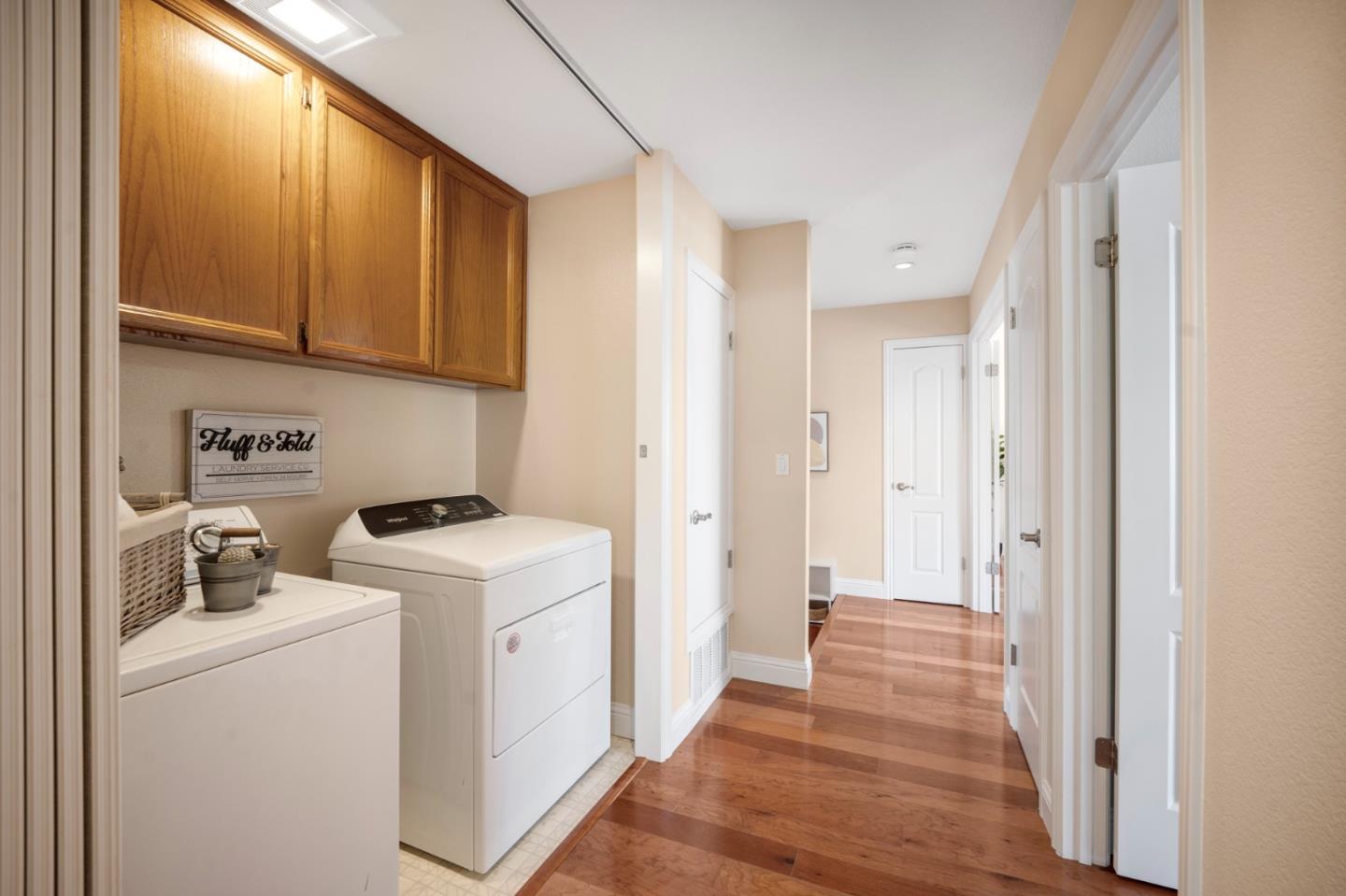 3053 Elk Ridge Court San Jose, CA 95136 - Photo 14 of 21 a view of a kitchen with fridge and wooden floor