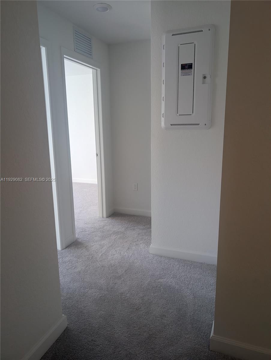 5180 Southwest 37th Street, Unit 5180 Hollywood, FL 33023 - Photo 19 of 25 a view of a closet area with an empty room