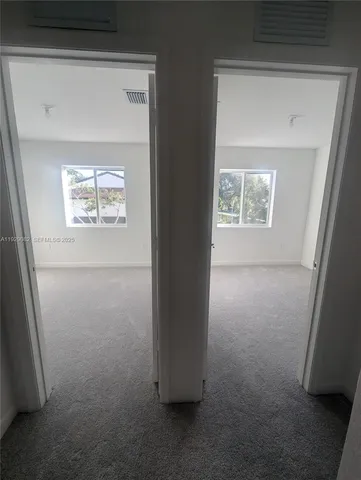 a view of hallway with closet