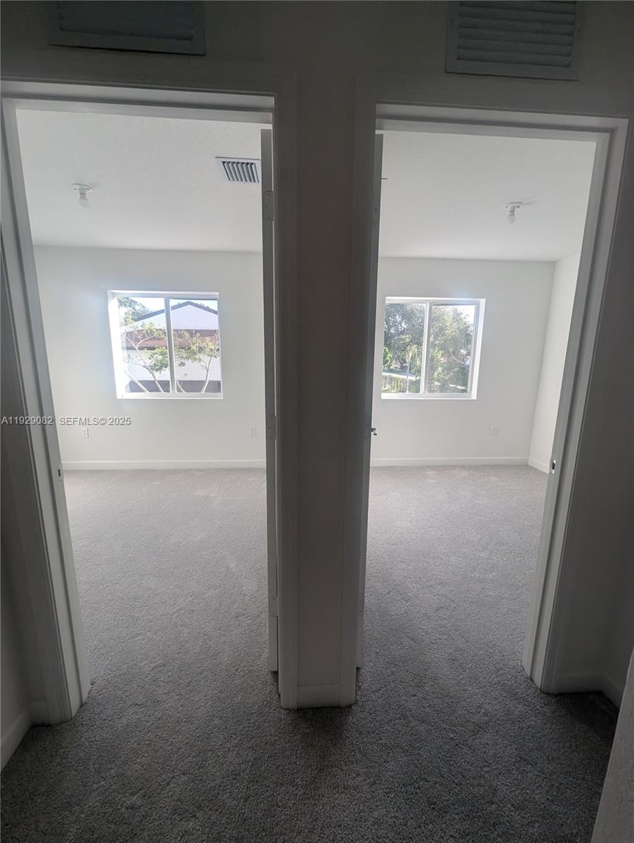 5180 Southwest 37th Street, Unit 5180 Hollywood, FL 33023 - Photo 20 of 25 a view of hallway with closet