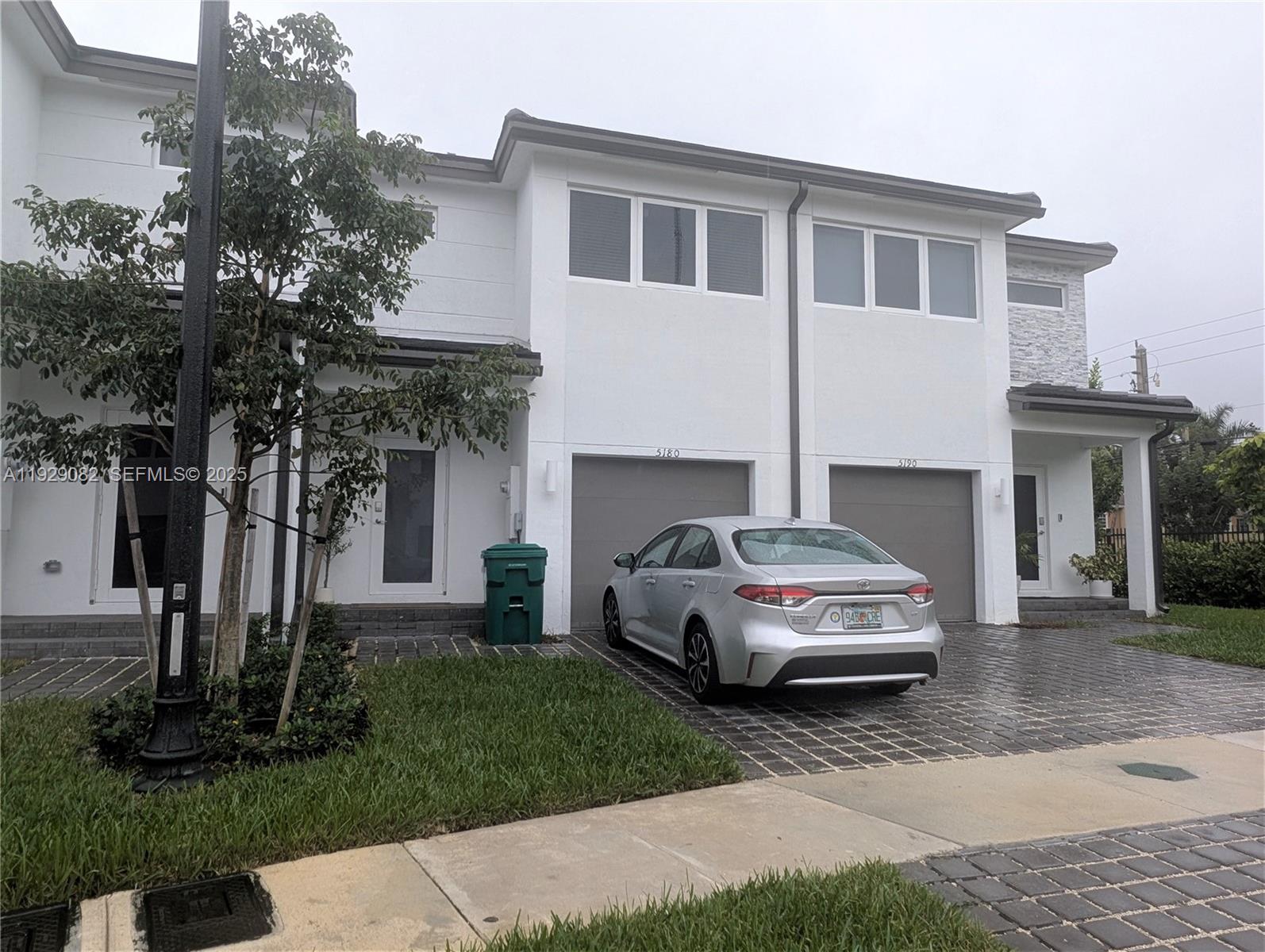 5180 Southwest 37th Street, Unit 5180 Hollywood, FL 33023 - Photo 2 of 25 a car parked in front of a house