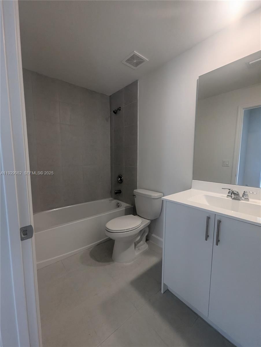 5180 Southwest 37th Street, Unit 5180 Hollywood, FL 33023 - Photo 24 of 25 a bathroom with a sink a toilet and shower