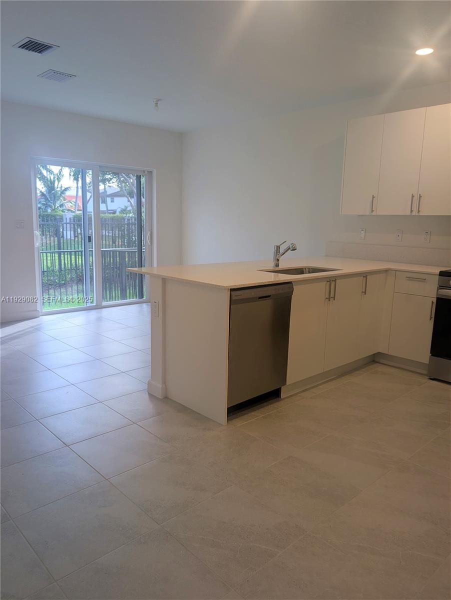 5180 Southwest 37th Street, Unit 5180 Hollywood, FL 33023 - Photo 8 of 25 a view of an empty room with glass door