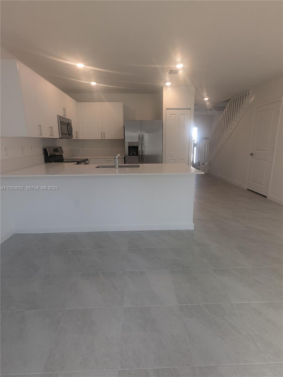 5180 Southwest 37th Street, Unit 5180 Hollywood, FL 33023 - Photo 10 of 25 a view of kitchen and a window