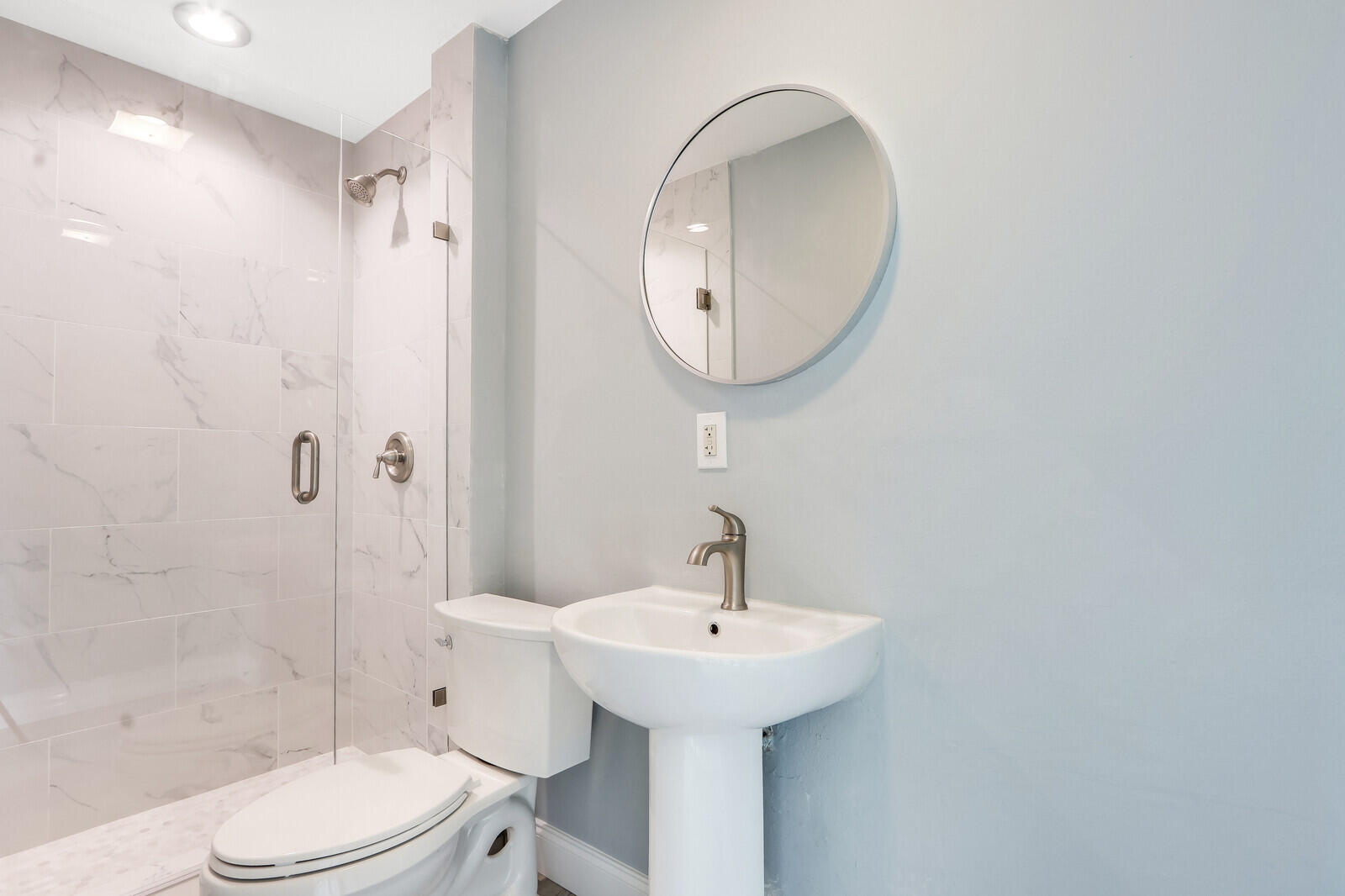 3852 Gull Road Palm Beach Gardens, FL 33410 - Photo 16 of 30 a bathroom with a sink toilet and shower