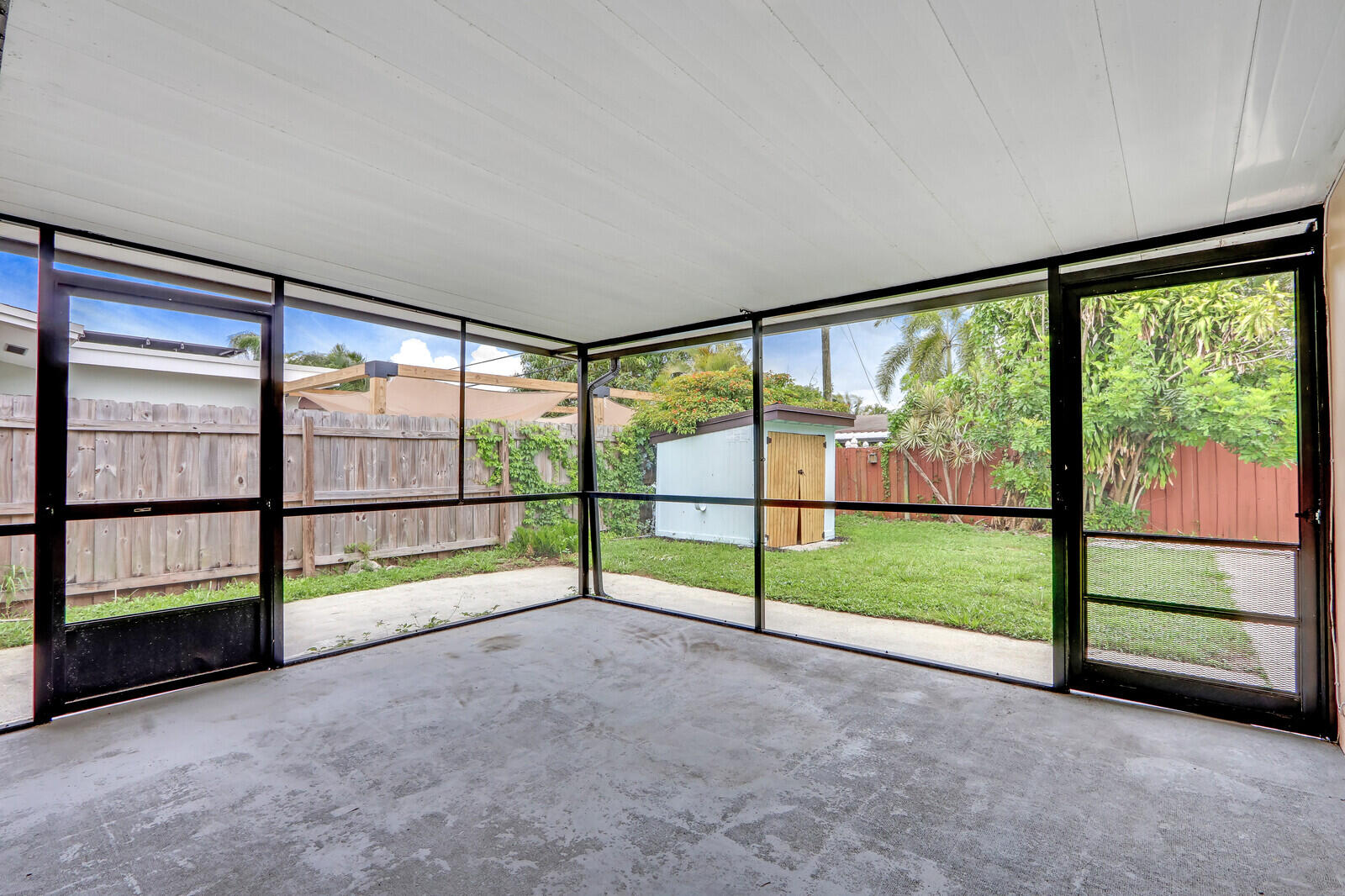 3852 Gull Road Palm Beach Gardens, FL 33410 - Photo 23 of 30 a view of empty room with sliding windows
