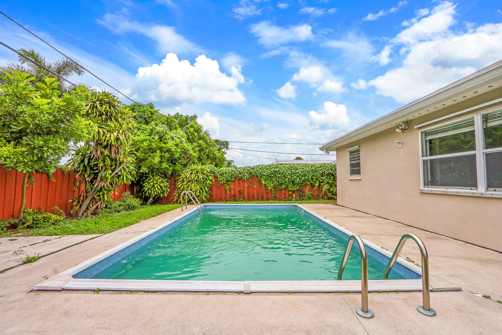 3852 Gull Road Palm Beach Gardens, FL 33410 - Photo 27 of 30 a view of a backyard with a garden