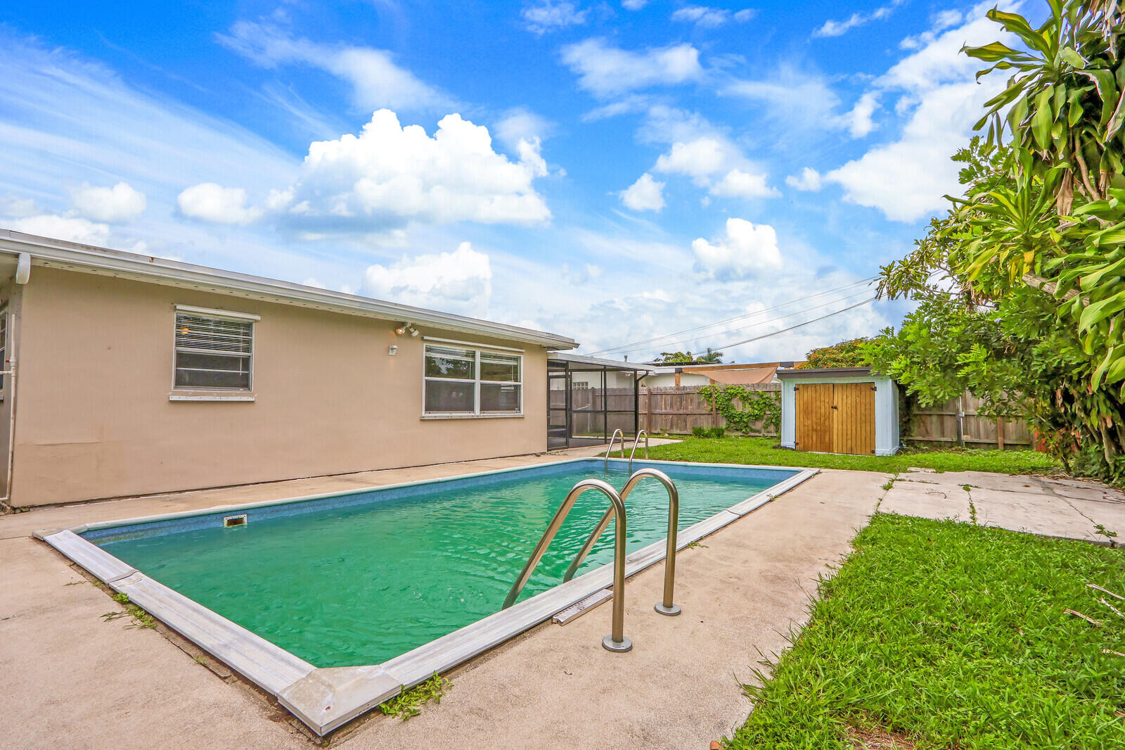 3852 Gull Road Palm Beach Gardens, FL 33410 - Photo 29 of 30 a view of a house with a backyard