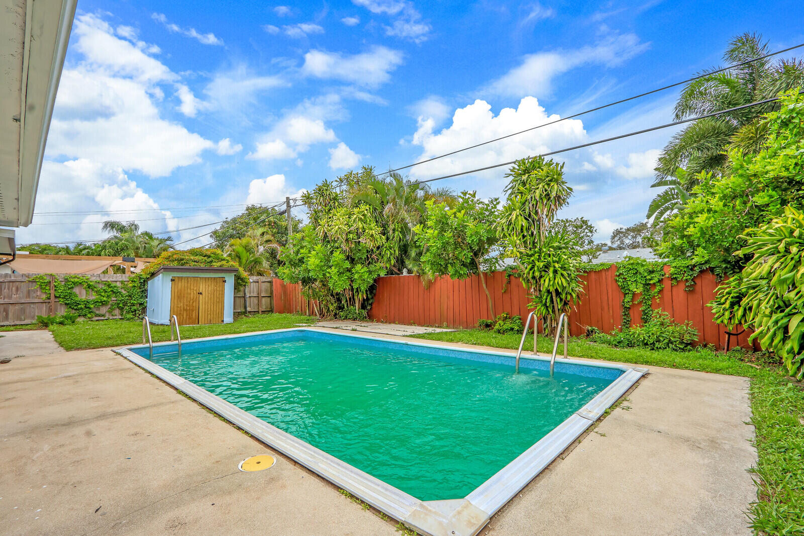 3852 Gull Road Palm Beach Gardens, FL 33410 - Photo 30 of 30 a view of a backyard with a garden