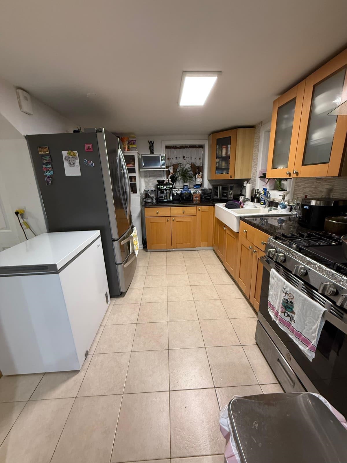 6517 Durham Avenue, Unit 1 North Bergen, NJ 07047 - Photo 5 of 9 a kitchen with stainless steel appliances a refrigerator sink and cabinets