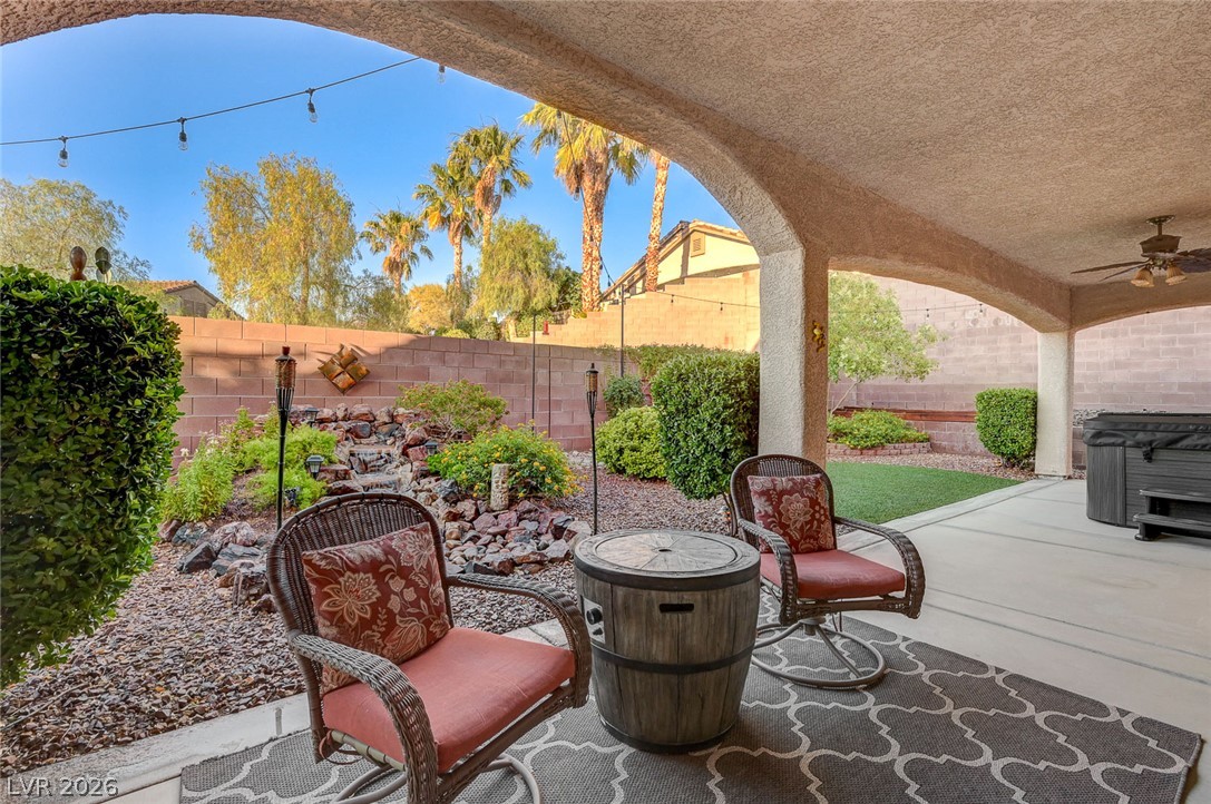 1604 Cattle Ranch Place Henderson, NV 89002 - Photo 70 of 99 A spacious covered patio offers a refreshing escape with a built-in spa and tranquil water feature.