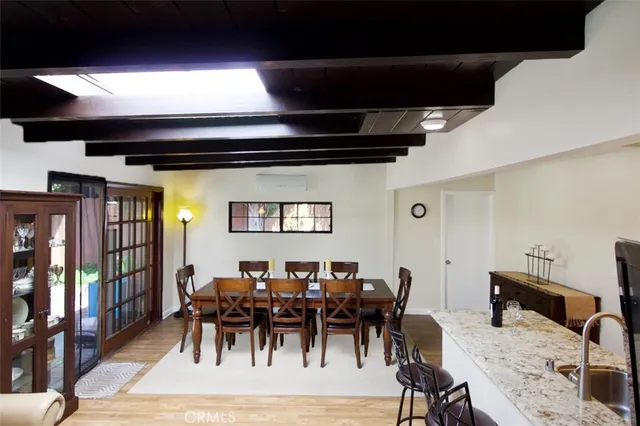 a view of a dining area with furniture and chandelier