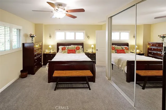 a room with pool table and windows