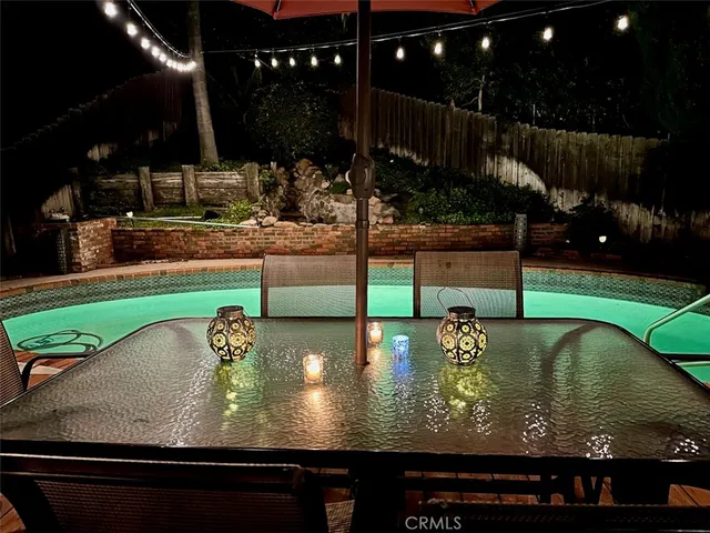 a view of a swimming pool with a patio