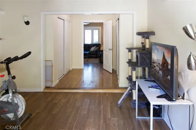 a view of a livingroom with furniture and hardwood floor