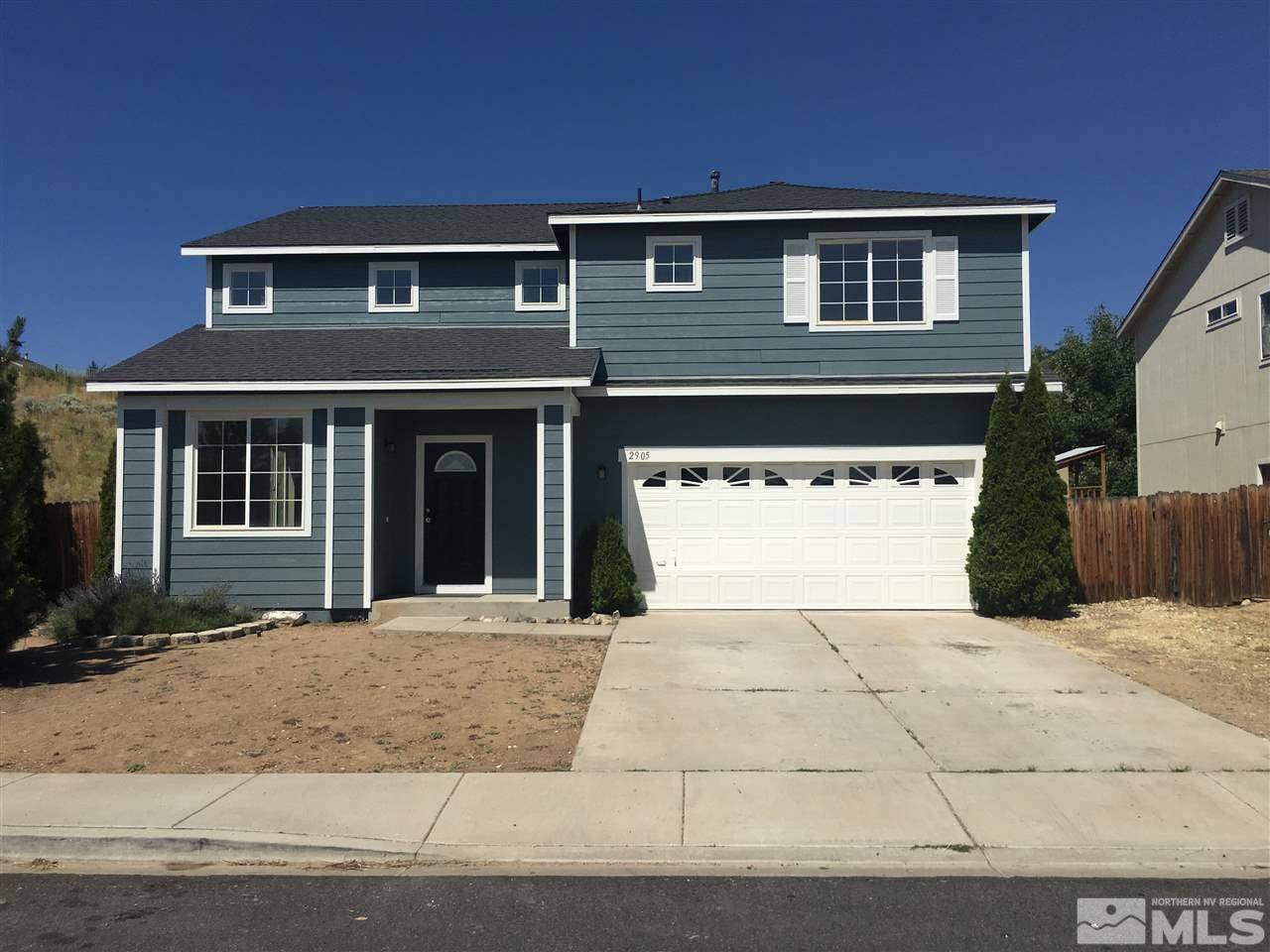 2905 Crown Canyon Court Reno, NV 89503 - Photo 1 of 1 a front view of a house with a yard and garage