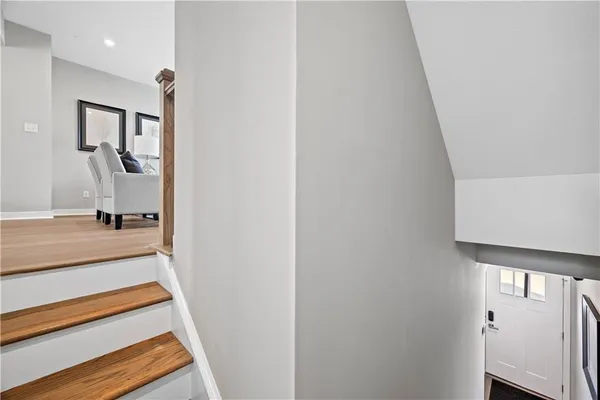 a view of staircase with white walls