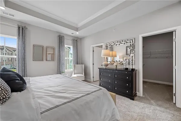 a bedroom with a bed and a closet