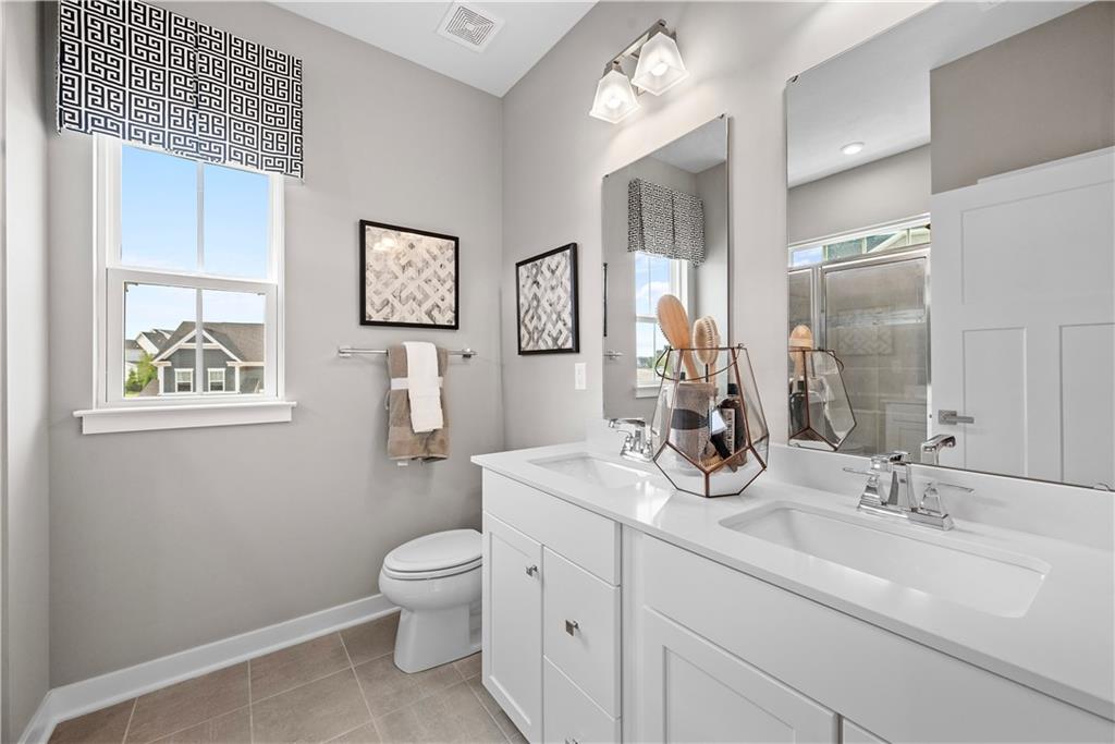 8100 Walnut Way Gibsonia, PA 15044 - Photo 22 of 40 a bathroom with a toilet a sink and mirror