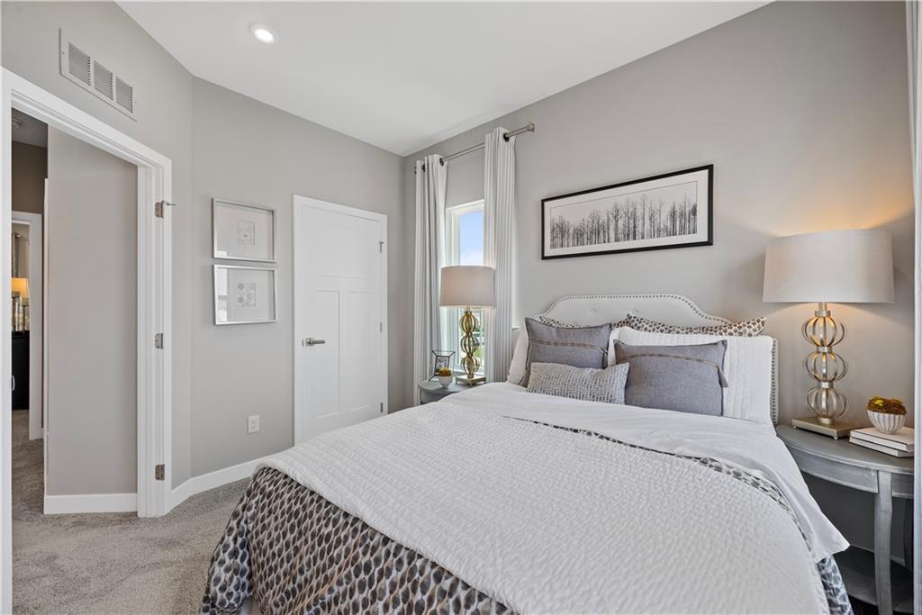 8100 Walnut Way Gibsonia, PA 15044 - Photo 27 of 40 a bedroom with a bed and a lamp