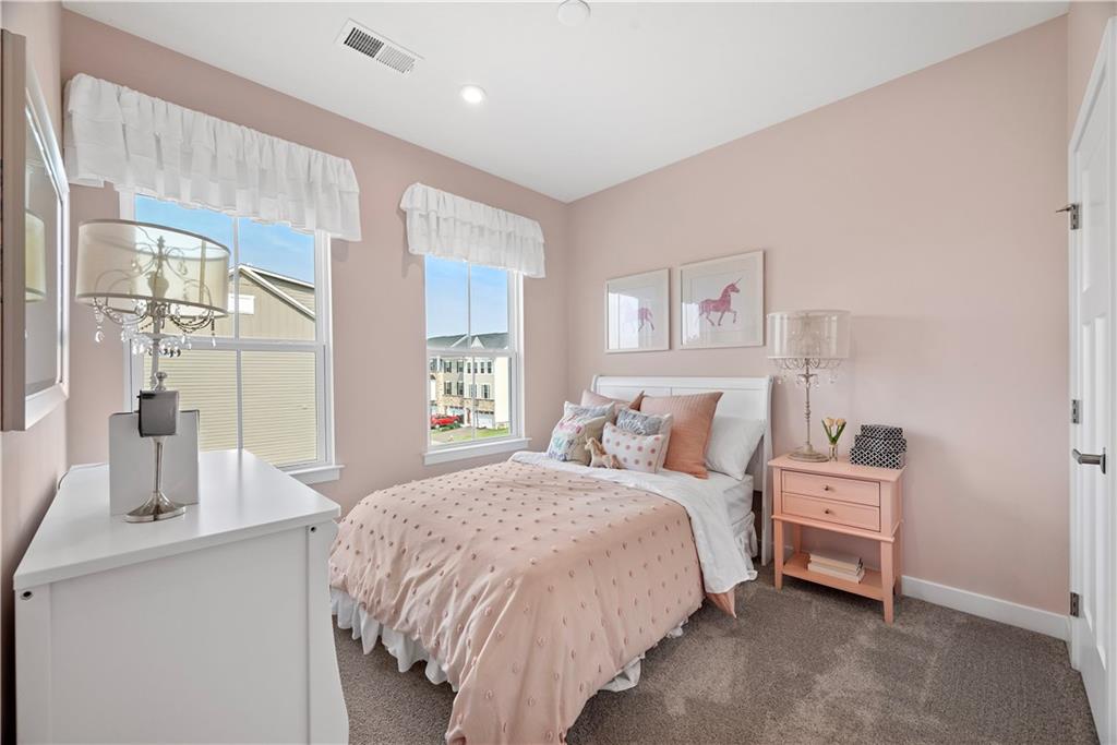 8100 Walnut Way Gibsonia, PA 15044 - Photo 29 of 40 a bedroom with a bed and large windows