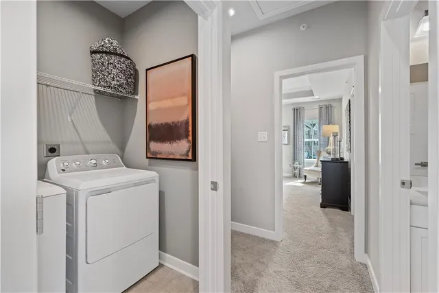 a view of hallway with washer and dryer