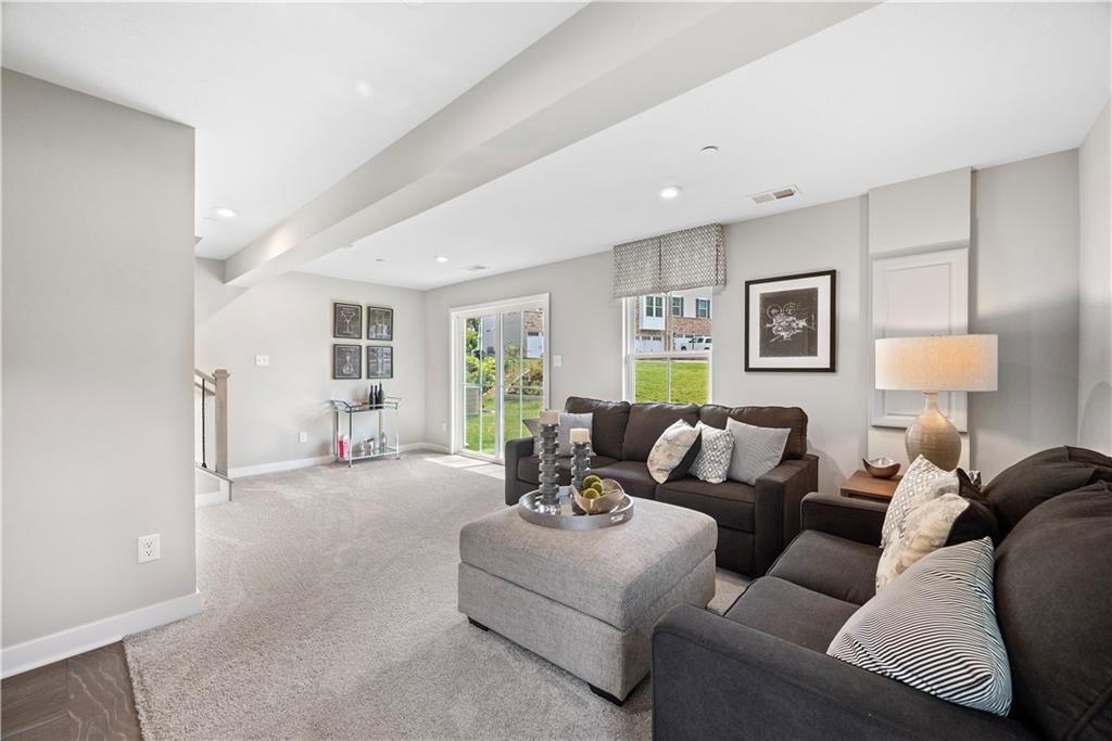 8100 Walnut Way Gibsonia, PA 15044 - Photo 36 of 40 a living room with furniture and a lamp