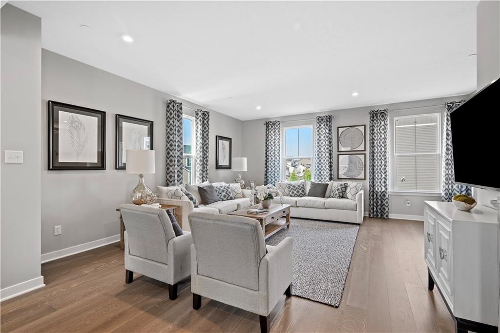 8100 Walnut Way Gibsonia, PA 15044 - Photo 7 of 40 a living room with furniture a flat screen tv and large window