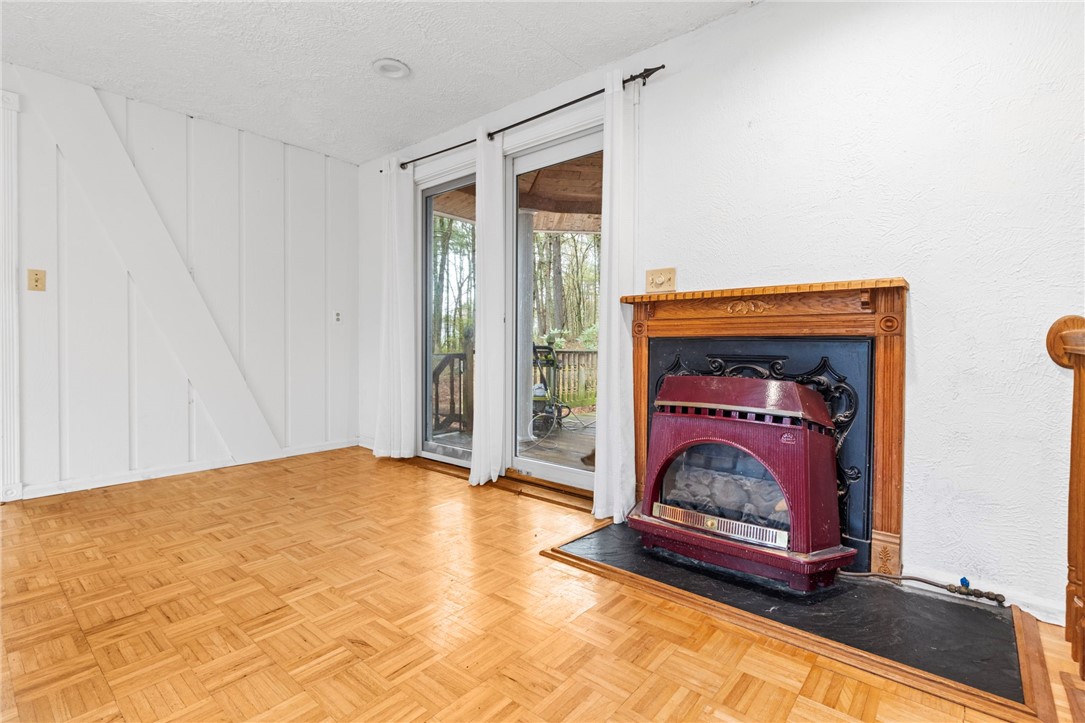 535 Log Road Smithfield, RI 02917 - Photo 14 of 48 Gas insert fireplace with view to back deck