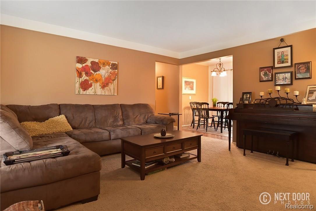 8988 Farmington Road Livonia, MI 48150 - Photo 9 of 21 Huge family room with hard wood under carpet