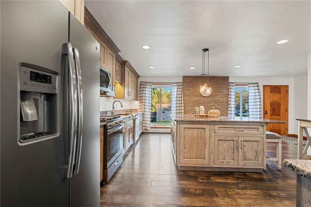127 Singer Way Ligonier, PA 15658 - Photo 8 of 46 Stainless steel appliances, including a propane range, bring modern convenience to this thoughtfully designed space.