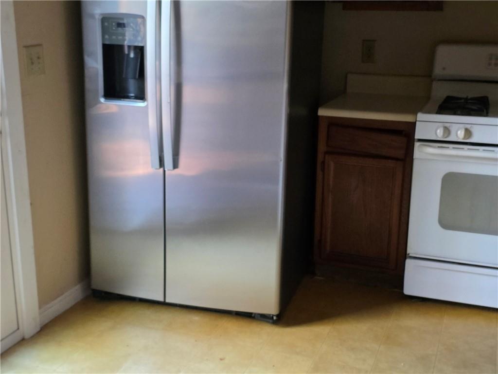 3484 Kingswood Trail Decatur, GA 30034 - Photo 14 of 37 a kitchen with a refrigerator and cabinets