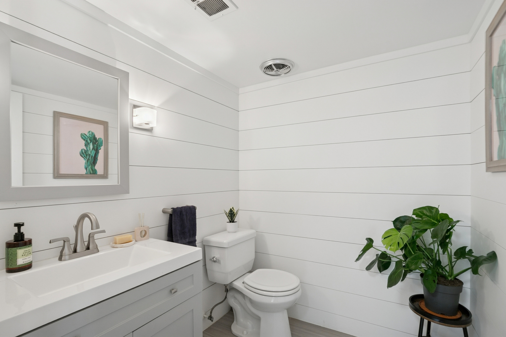 635 East Golf Road Libertyville, IL 60048 - Photo 12 of 21 a bathroom with a toilet sink and mirror