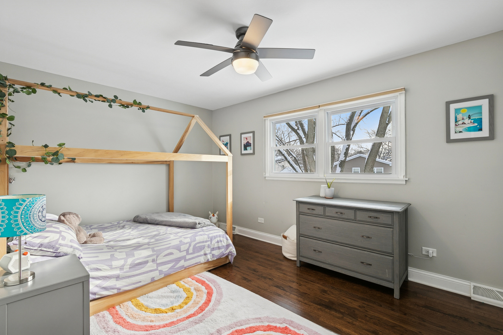 635 East Golf Road Libertyville, IL 60048 - Photo 15 of 21 a bedroom with a bed and a chandelier