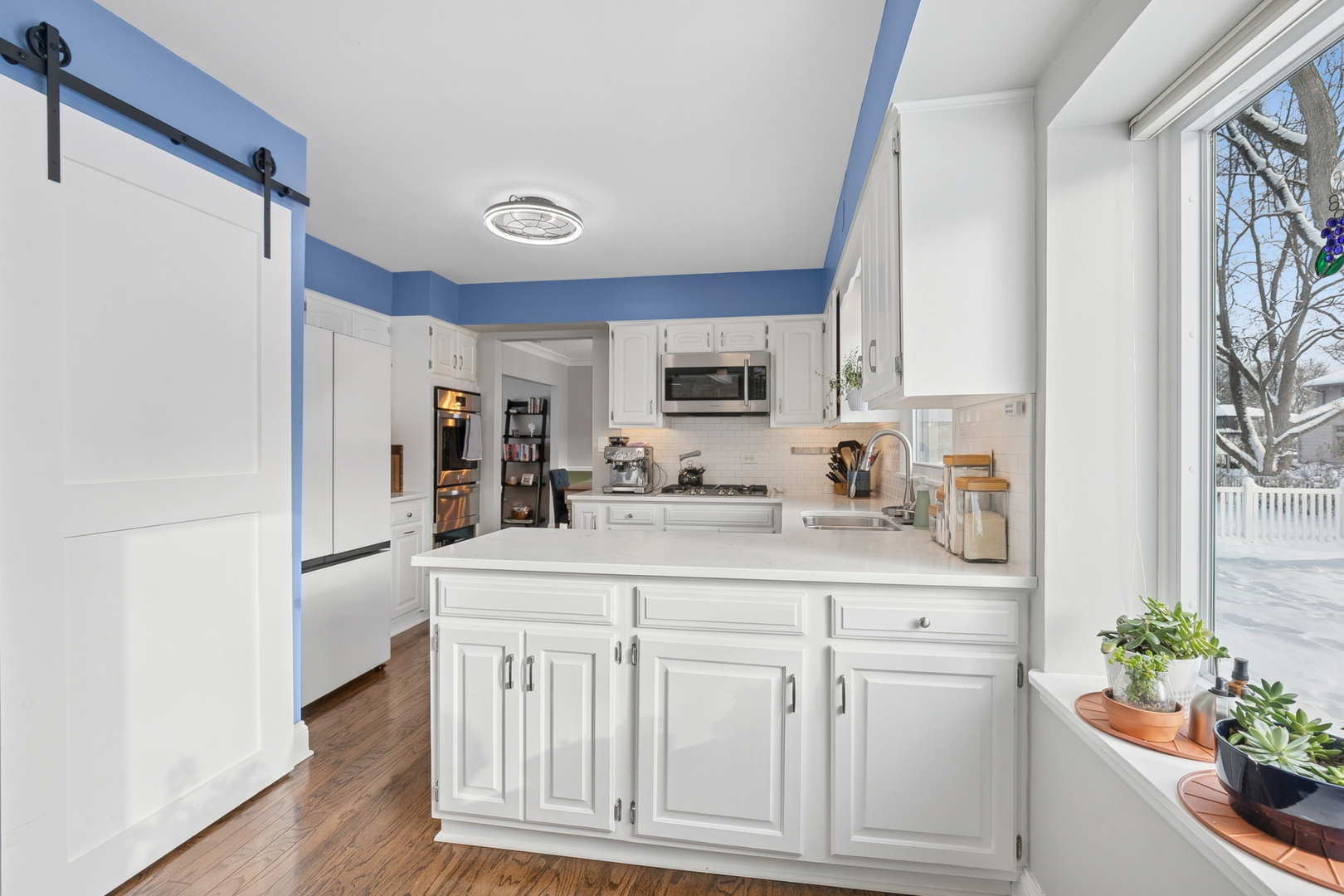 635 East Golf Road Libertyville, IL 60048 - Photo 7 of 21 a kitchen with white cabinets and refrigerator