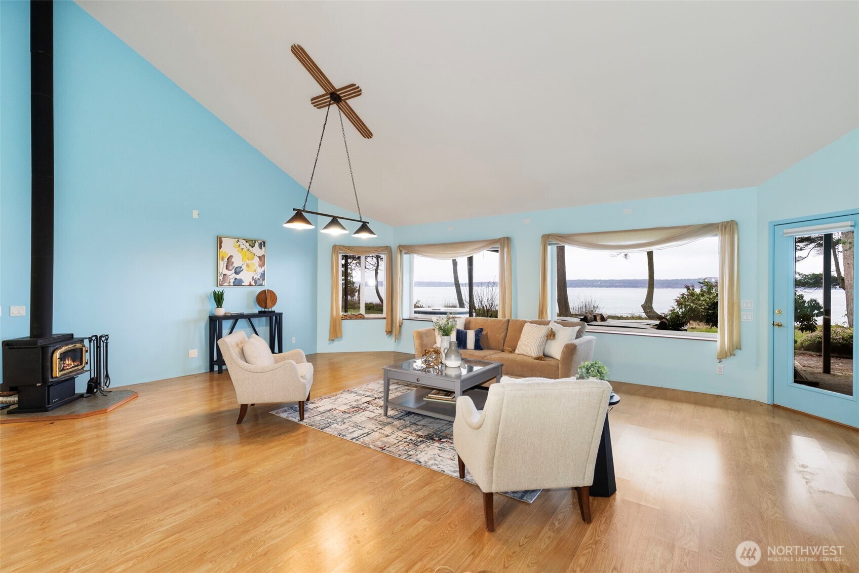 824 Schwartz Road Nordland, WA 98358 - Photo 15 of 40 a living room with furniture and a chandelier