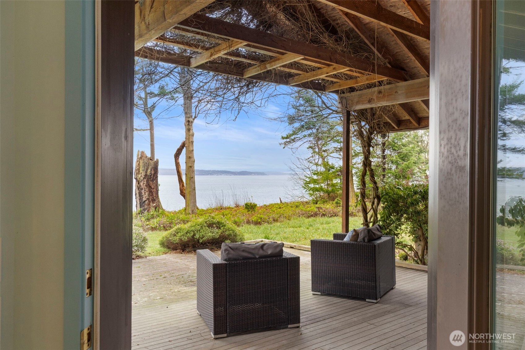 824 Schwartz Road Nordland, WA 98358 - Photo 17 of 40 a view of a couches chair and table in the balcony