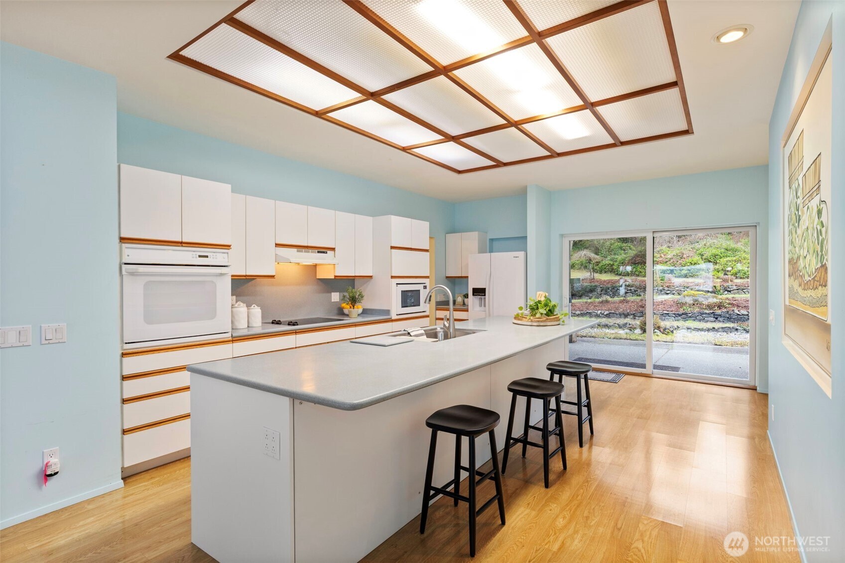 824 Schwartz Road Nordland, WA 98358 - Photo 18 of 40 a kitchen with kitchen island a stove a table and chairs in it