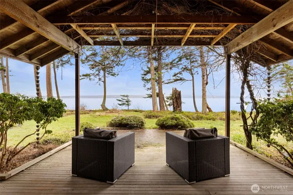 a view of a couches chair and table in the patio