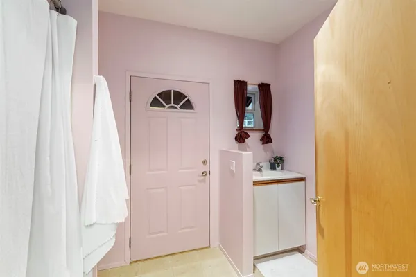 a bathroom with a sink and mirror