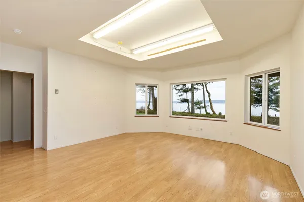 a view of an empty room with a window