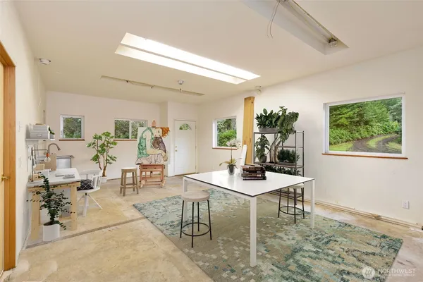 a workspace with furniture and window