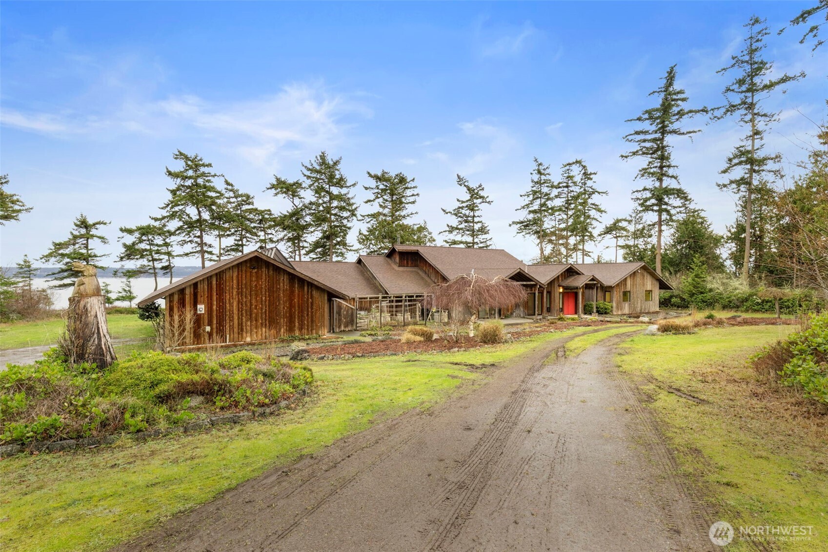 824 Schwartz Road Nordland, WA 98358 - Photo 7 of 40 a yellow house with trees in front of it
