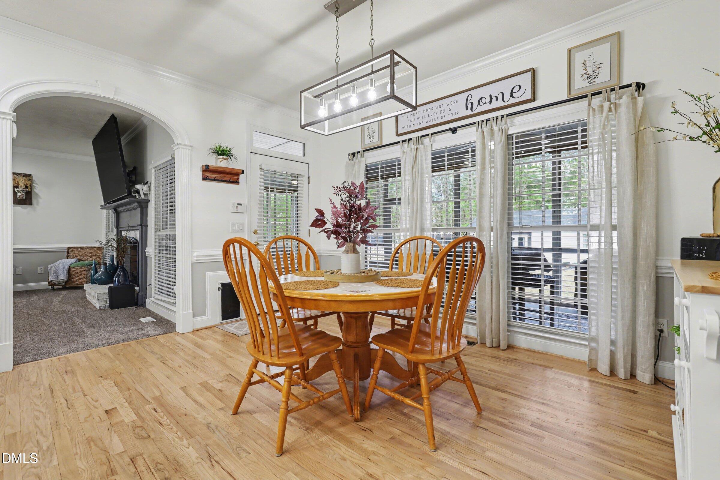430 Fred Hall Road Stedman, NC 28391 - Photo 10 of 63 a view of a dining room with furniture window and wooden floor