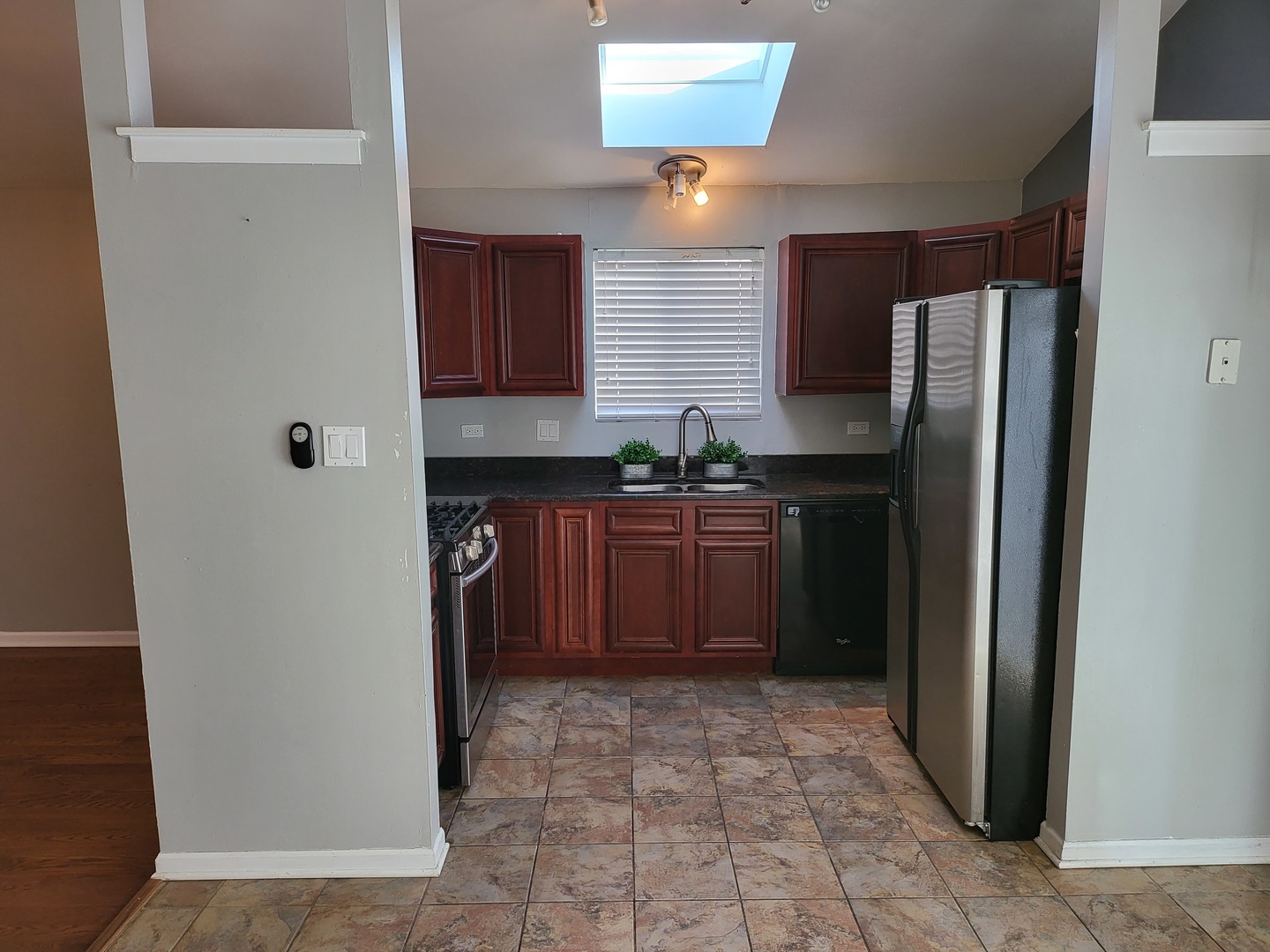 61 White Oaks Road Matteson, IL 60443 - Photo 3 of 4 a kitchen with a sink and a refrigerator
