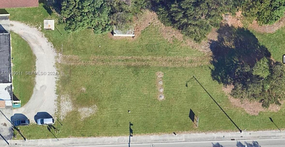 2065 Northwest 54th Street Miami, FL 33142 - Photo 2 of 3 a aerial view of a residential houses with yard