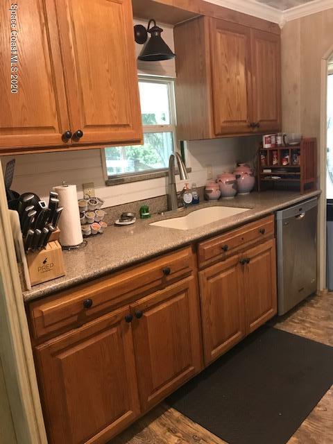 470 Baker Road Merritt Island, FL 32953 - Photo 8 of 21 a kitchen with granite countertop cabinets and window