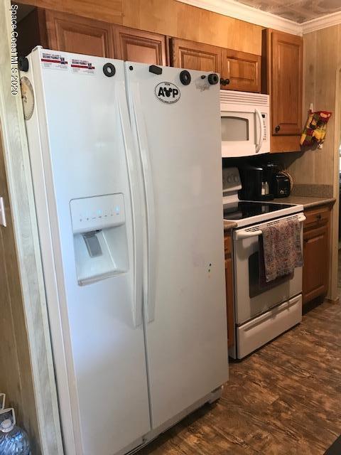 470 Baker Road Merritt Island, FL 32953 - Photo 9 of 21 a white refrigerator freezer sitting inside of a kitchen